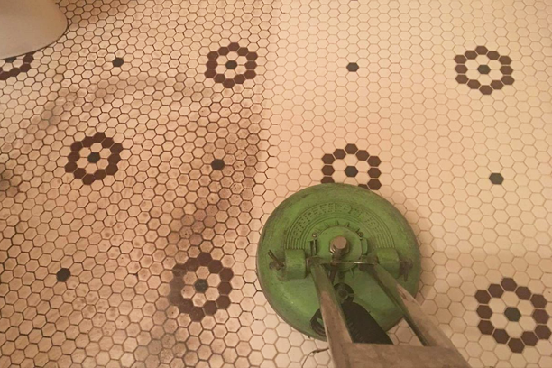 Rotary scrubber deep cleaning dirty tile and grout floor